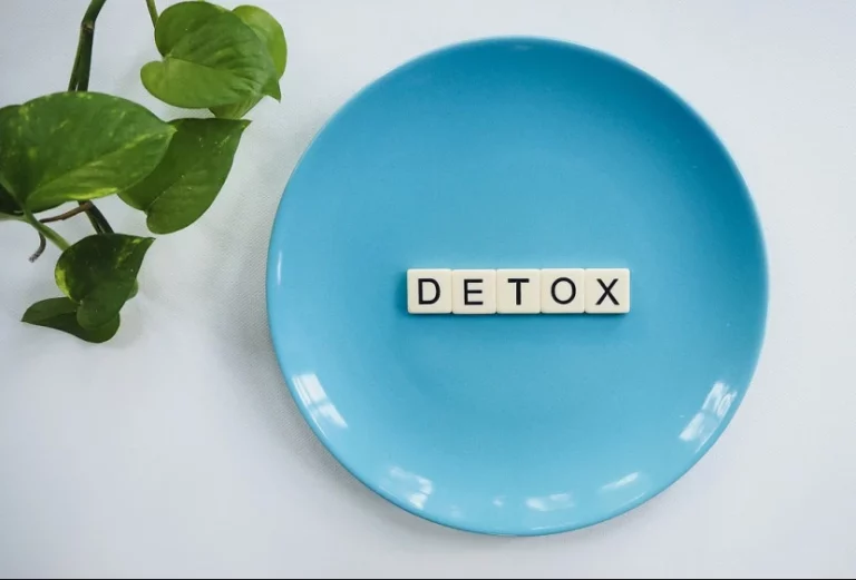 Detox word over blue plate