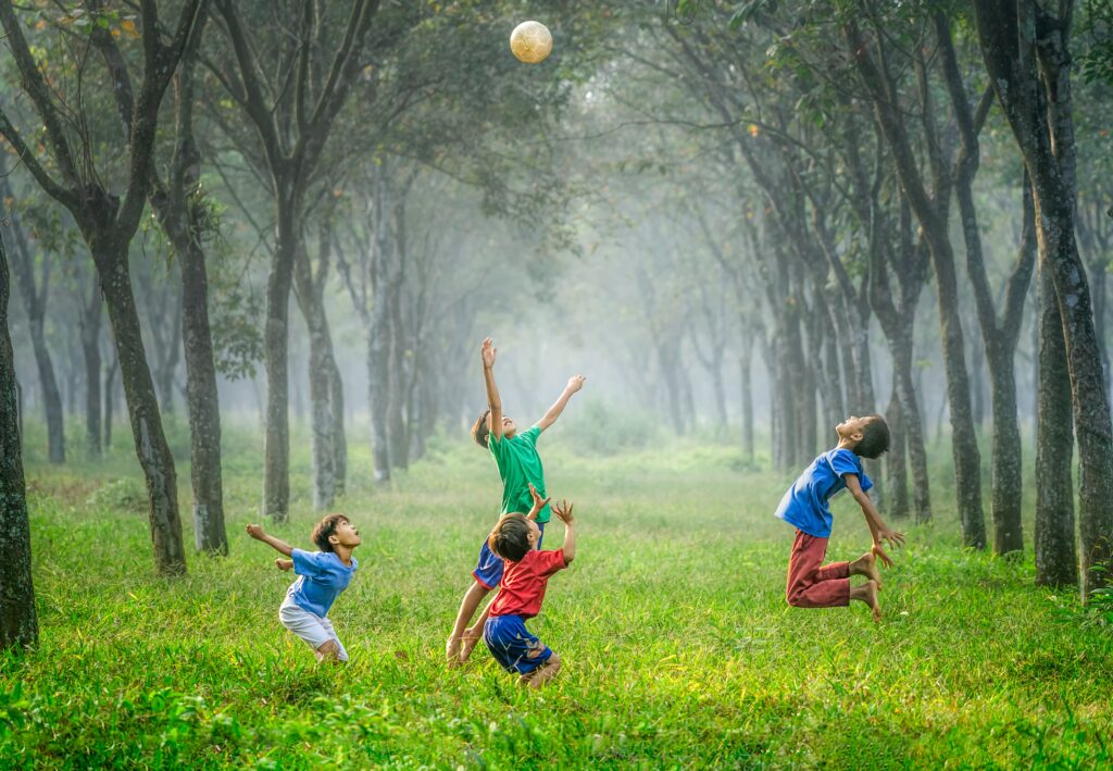 boys jumping in park