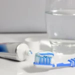 Tap water and toothpaste with fluoride