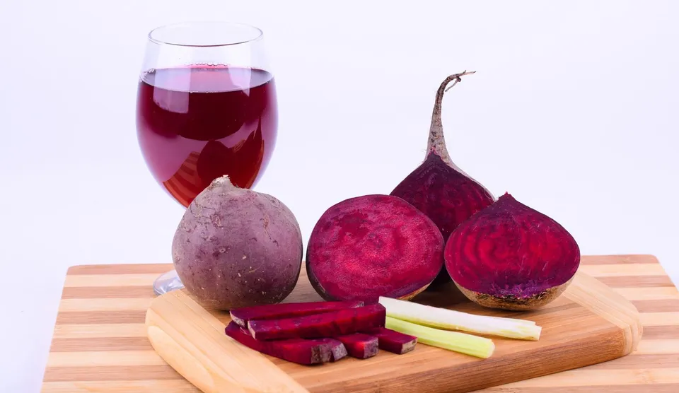 Image of raw beetroot, beet slices, and juice