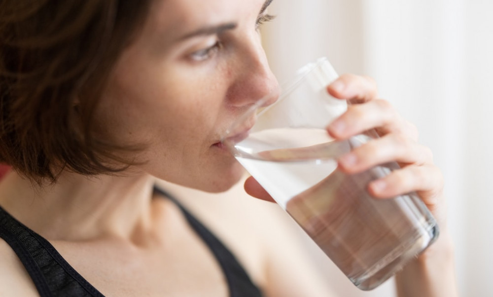 image of a woman drinking water