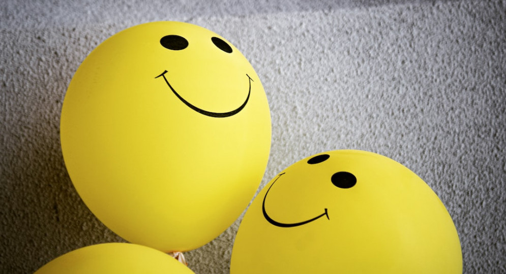 Image of yellow ballons with smiling faces