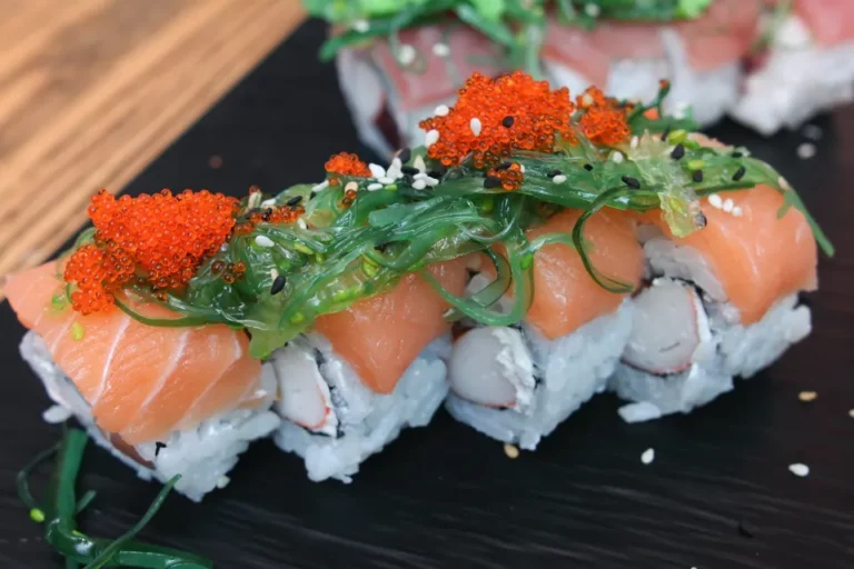 Image of a plate of sushi rolls with fish, seaweed and fish roe