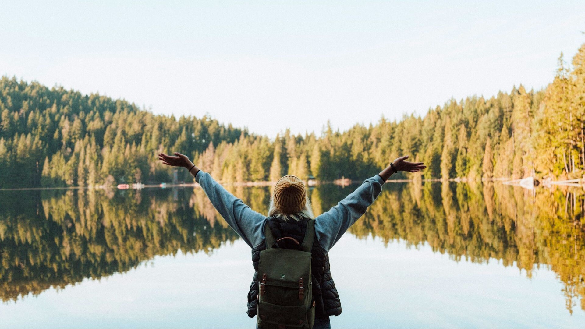 woman in landscape with open arms