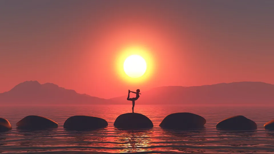 Woman in a Yoga pose in a serene landscape of nature